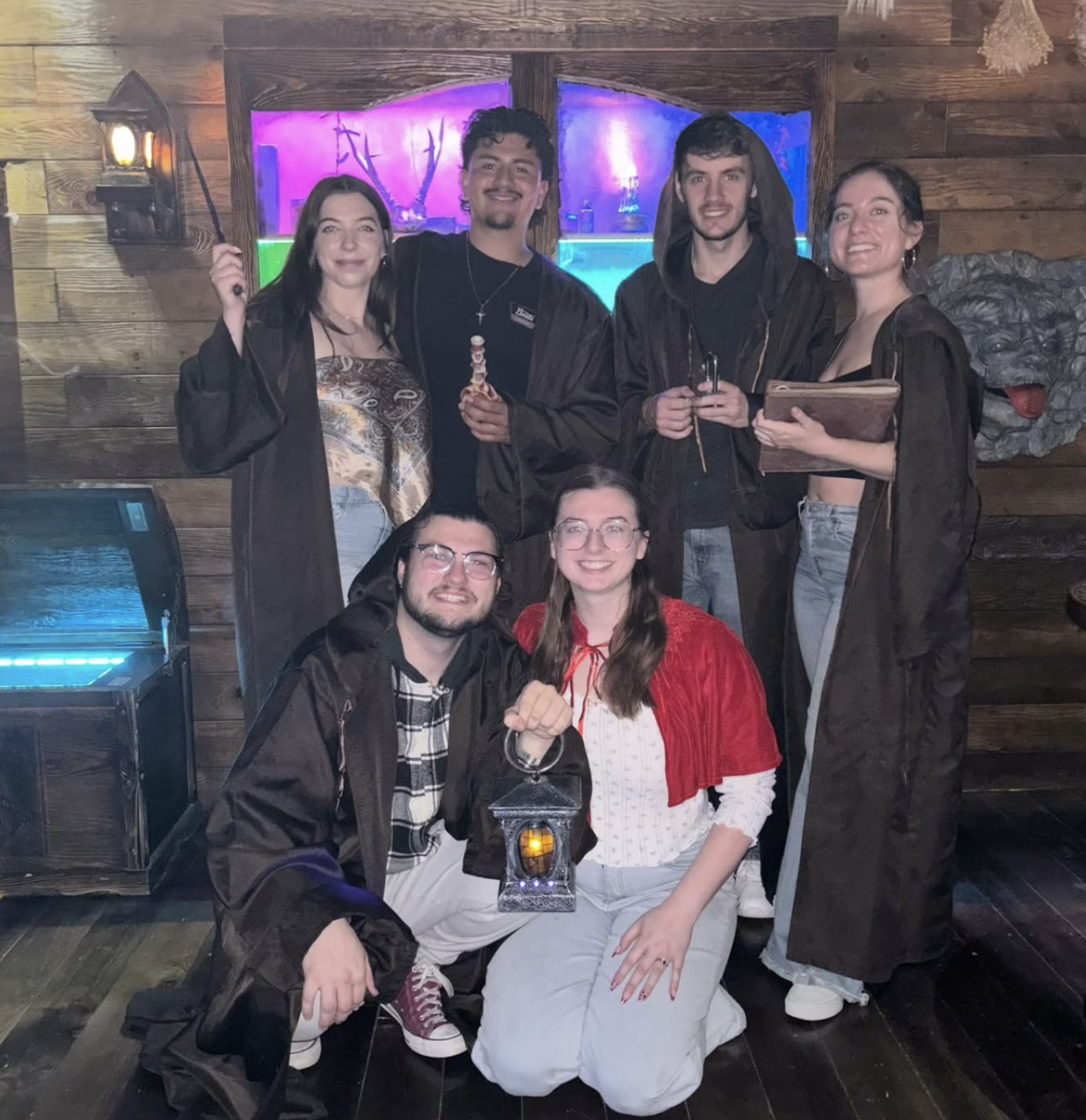 Players casting spells in a haunted witch escape room